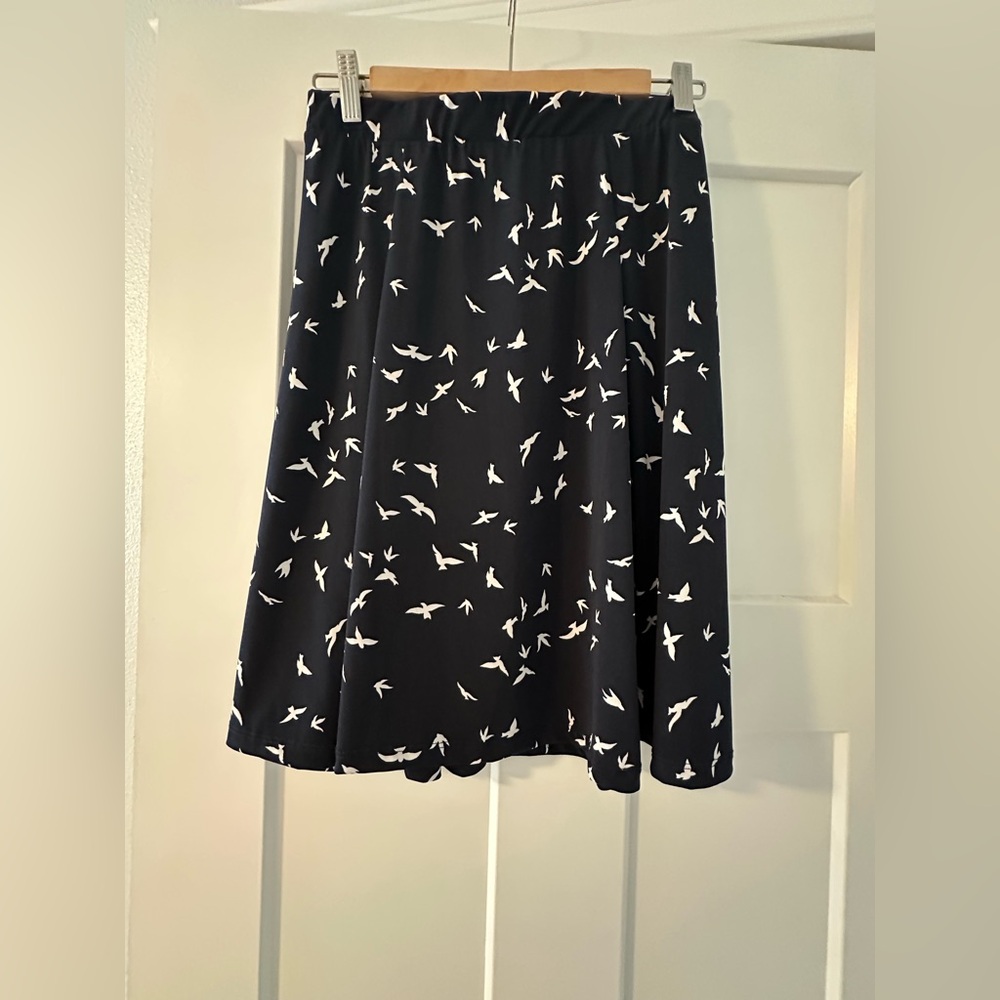 Dark indigo skirt with bird pattern